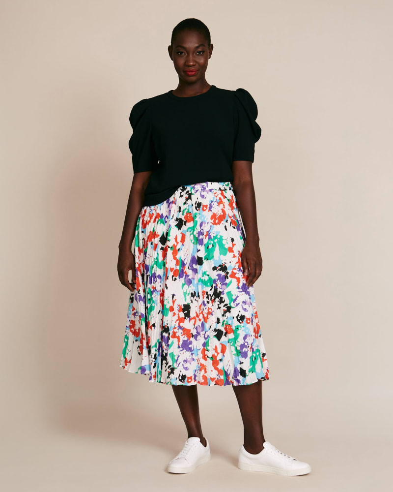 Front of a model wearing a size 12 Jeana Skirt in Painted Floral White by Tanya Taylor. | dia_product_style_image_id:226537